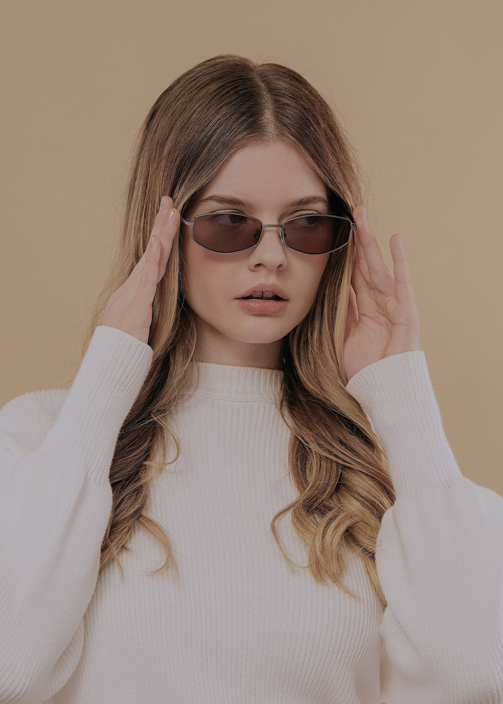 Female model wearing Sirius B Gunmetal Amber sunglasses – Elegant and versatile prescription eyewear.