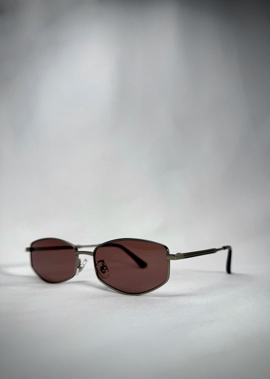 Angled view of Sirius B Gunmetal Amber sunglasses – Modern and stylish stainless steel frame with warm amber lenses. 