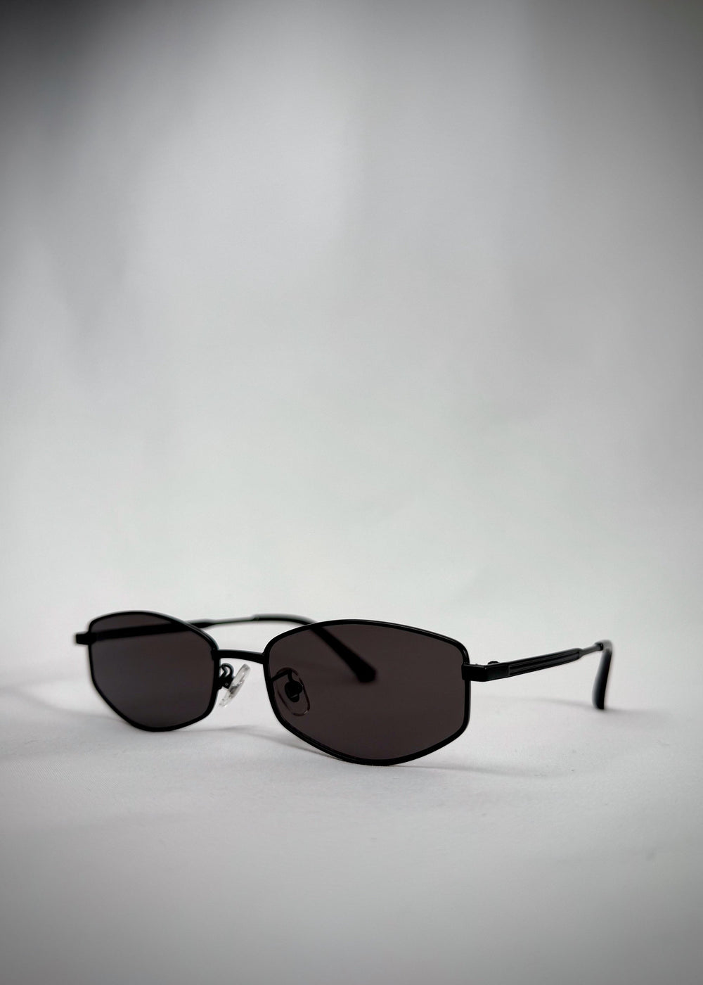 Angled view of Sirius B - Matte Black sunglasses, capturing the elegant matte black finish and modern silhouette.