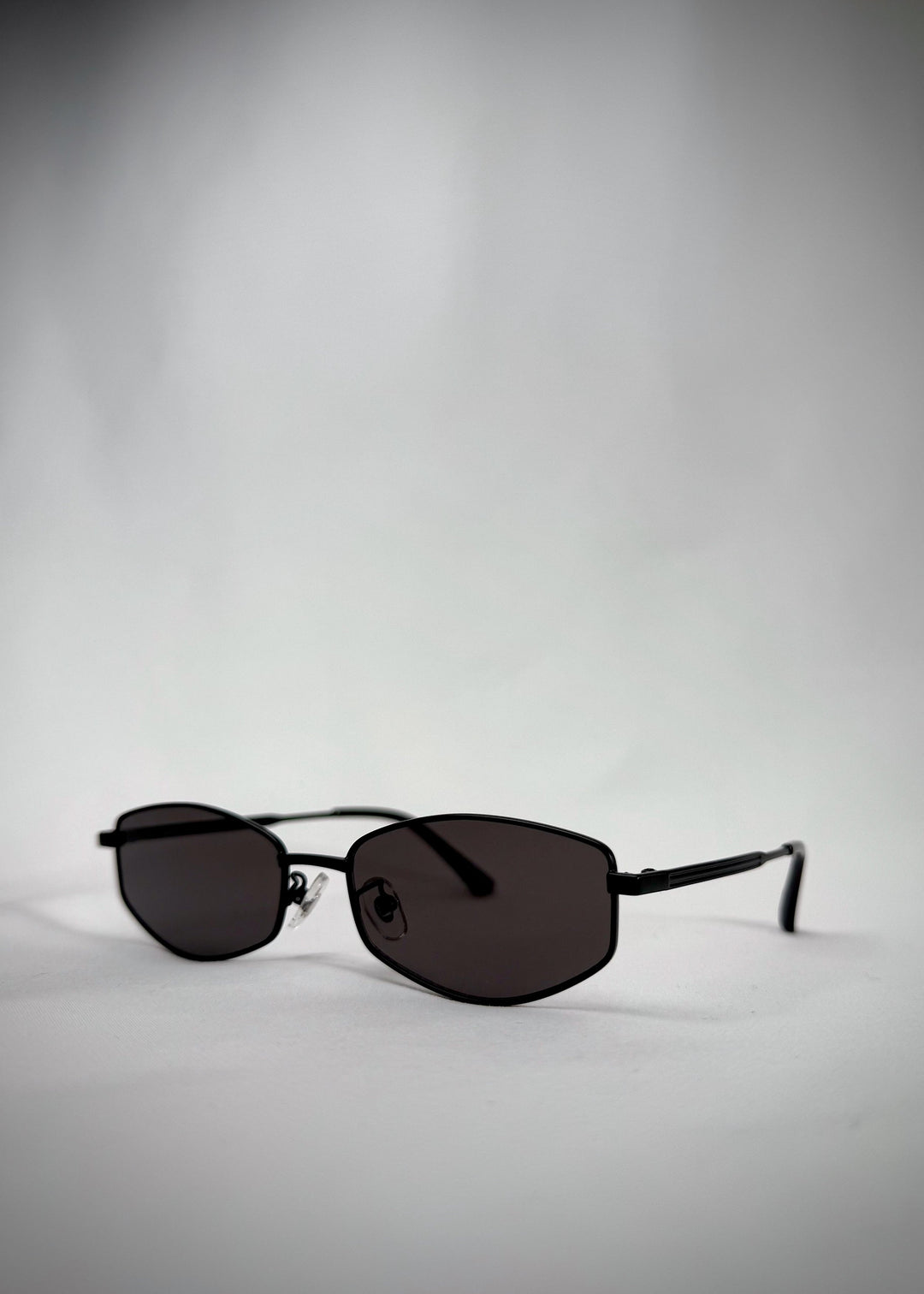 Angled view of Sirius B - Matte Black sunglasses, capturing the elegant matte black finish and modern silhouette. 