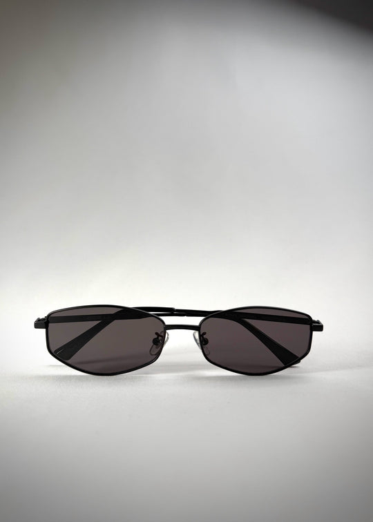 Folded Sirius B - Matte Black sunglasses, displaying its compact and durable frame for easy portability. 