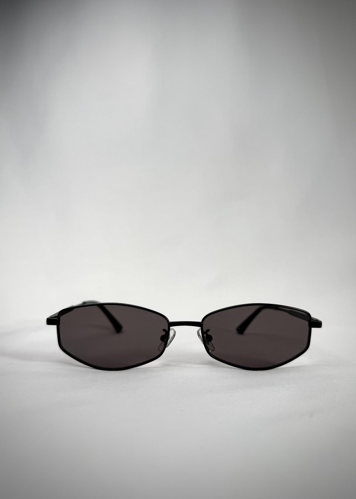 Front view of Sirius B sunglasses in Matte Black with a slim stainless-steel frame and neutral gray UV400 lenses.