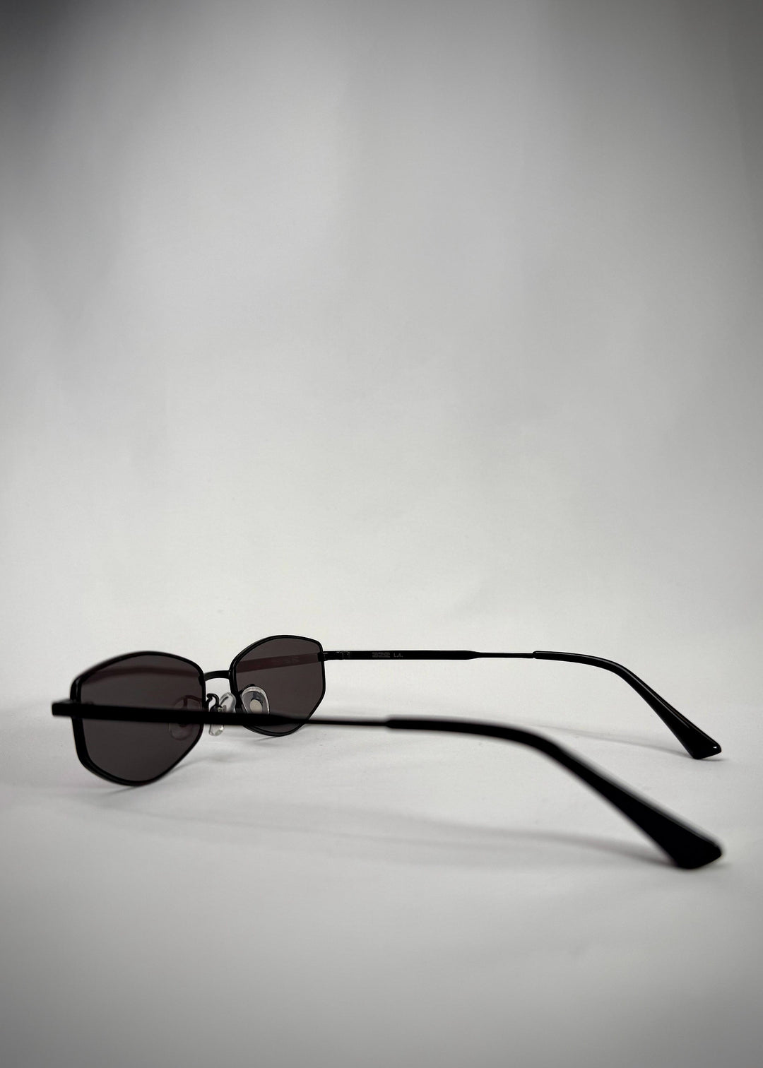 Side view of Sirius B sunglasses in Matte Black, highlighting the lightweight stainless-steel frame and adjustable nose pads. 