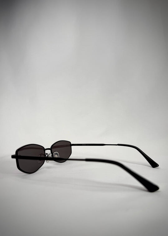 Side view of Sirius B sunglasses in Matte Black, highlighting the lightweight stainless-steel frame and adjustable nose pads. 
