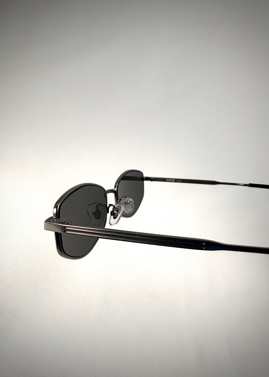 Second close-up of the temple and hinge detail on Sirius B sunglasses in Matte Black. 