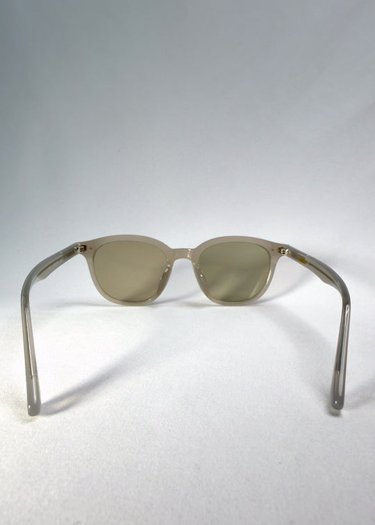 Back view of Elvor sunglasses in Glacier Smoke showing slim acetate temples and subtle curvature. 
