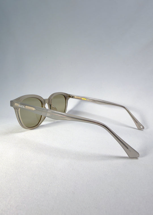 Side-temple view of Elvor Softint sunglasses in Glacier Smoke. The frosted acetate arms flow smoothly for lightweight comfort.