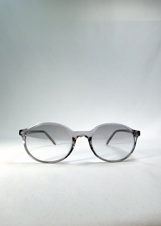 Front view of Glint Softint sunglasses in Crystal Verge featuring clear grey round frame and gradient smoke Softint lenses. 