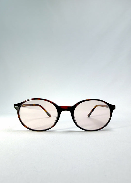 Front view of Glint Softint sunglasses in Umber Ripple featuring round tortoise frame and softly tinted rose lenses with UV400 protection. 