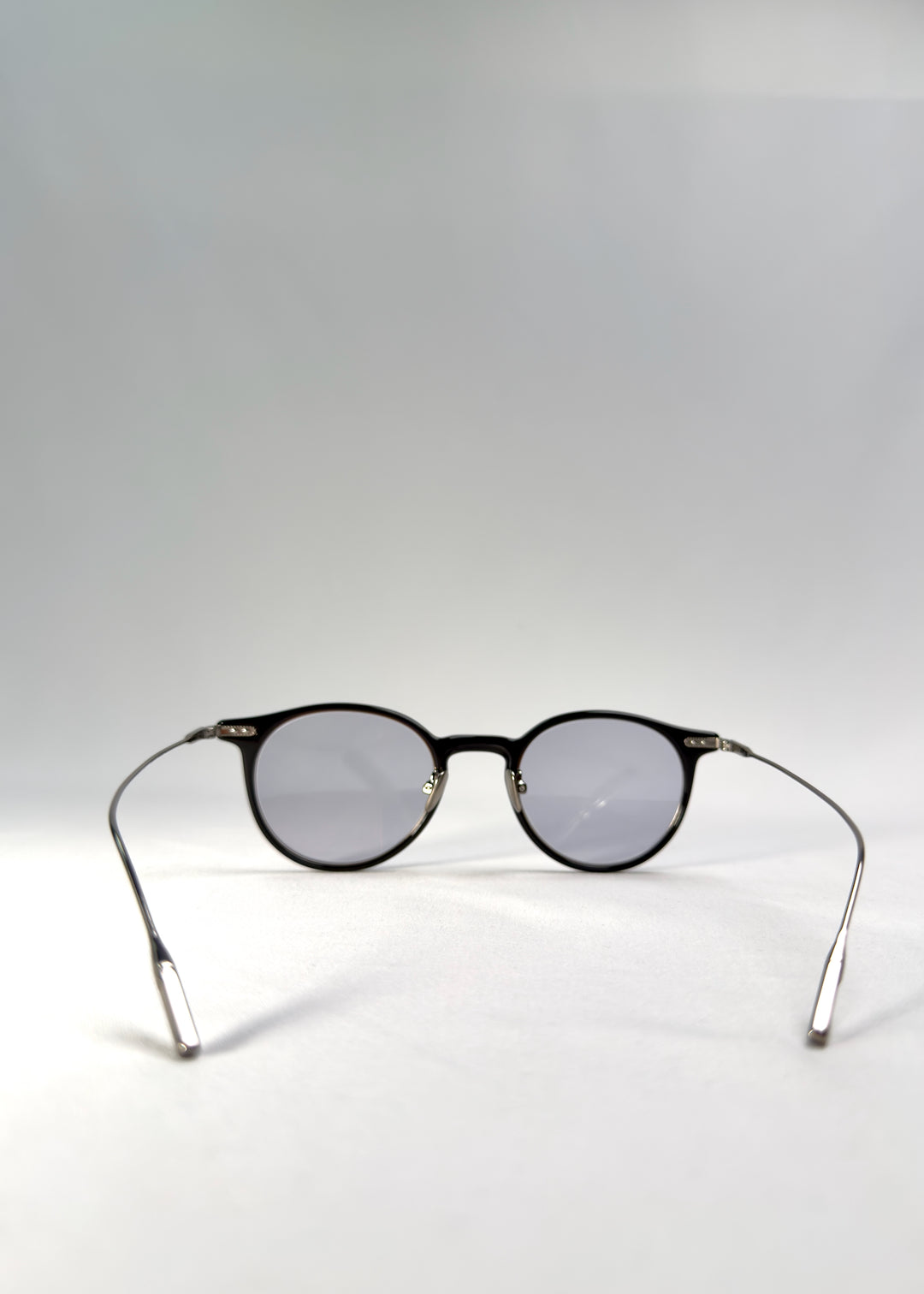 Back view of Lunor Drift Softint sunglasses in Onyx Fade displaying the hybrid acetate-titanium frame and lightweight structure.