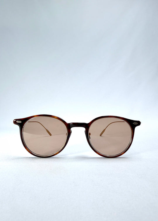 Front view of Lunor Drift Softint sunglasses in Umber Fade featuring round amber frame and rose-brown tinted Softint lenses. 