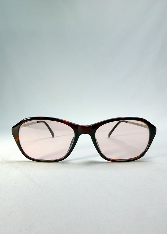 Front view of Ravynor Softint sunglasses in Burnt Amber featuring tortoiseshell rectangular frame and rose-brown Softint lenses.