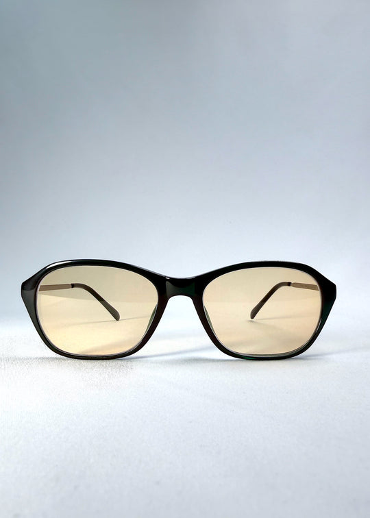 Front view of Ravynor Softint sunglasses in Jade Phase featuring rectangular green frame and light champagne Softint lenses.