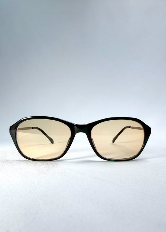 Front view of Ravynor Softint sunglasses in Jade Shadow featuring a deep green rectangular frame and light champagne Softint lenses. 