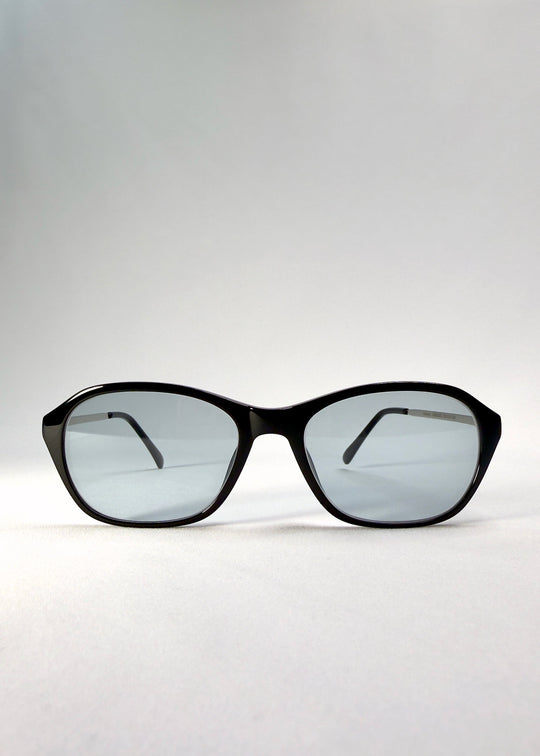 Front view of Ravynor Softint sunglasses in Noir Alloy featuring sharp rectangular frame and reflective grey-blue Softint lenses. 