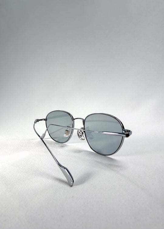 Back-angle view of Solen Softint sunglasses in Moonveil, showing the silver frame and slim titanium temples. 