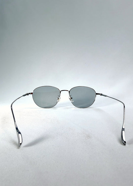Front view of Solen Softint sunglasses in Moonveil showing silver frame and pale blue-grey lenses.