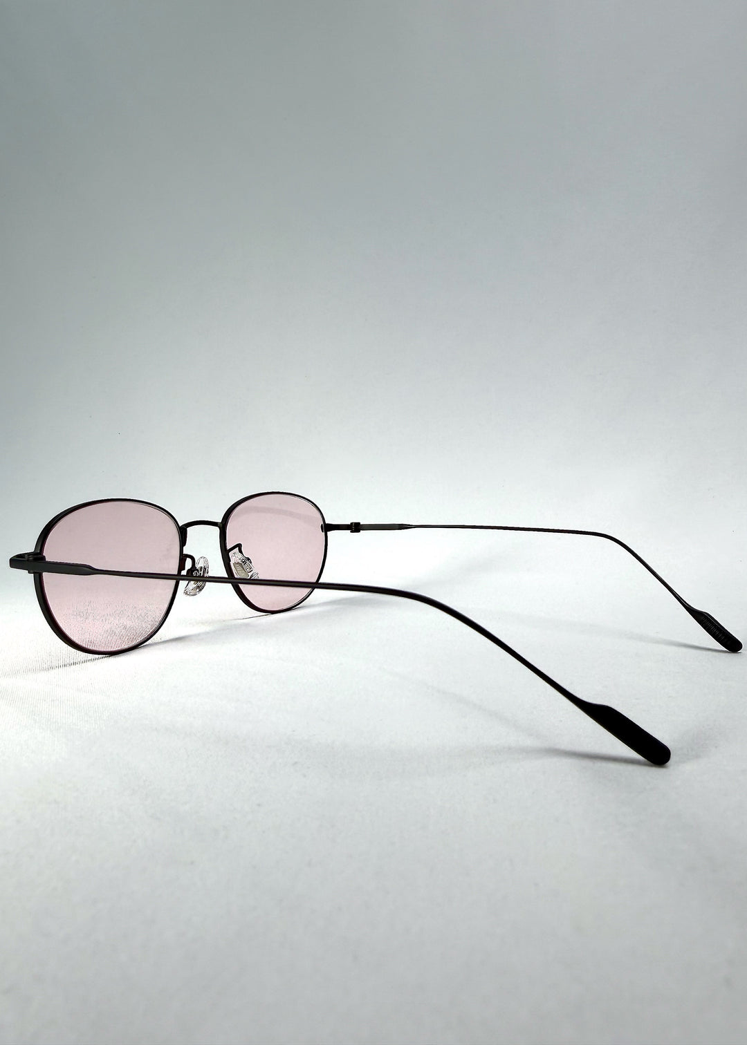 Side-temple view of Solen Softint sunglasses in Nightveil showing titanium temples and silicone nose pads.