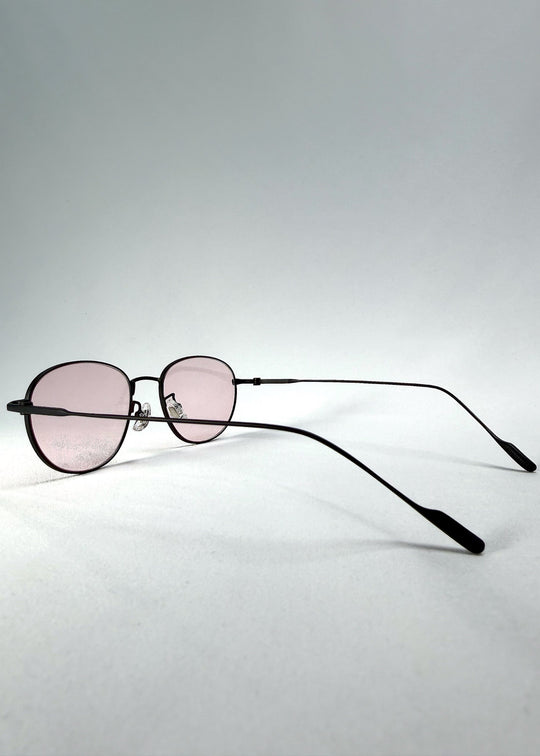 Side-temple view of Solen Softint sunglasses in Nightveil, showing the ultra-slim titanium temples and adjustable nose pads. 