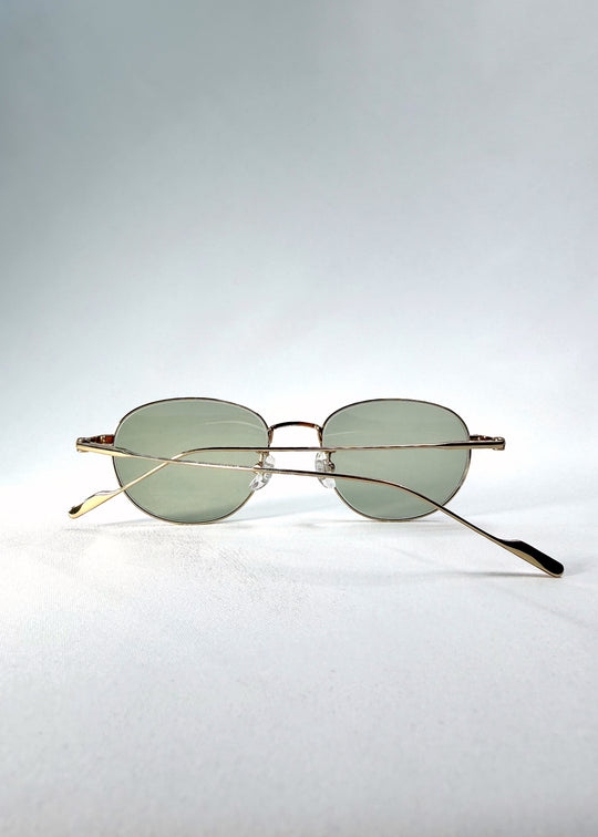 Folded-angle view of Solen Softint sunglasses in Sunveil displaying elegant metal construction.