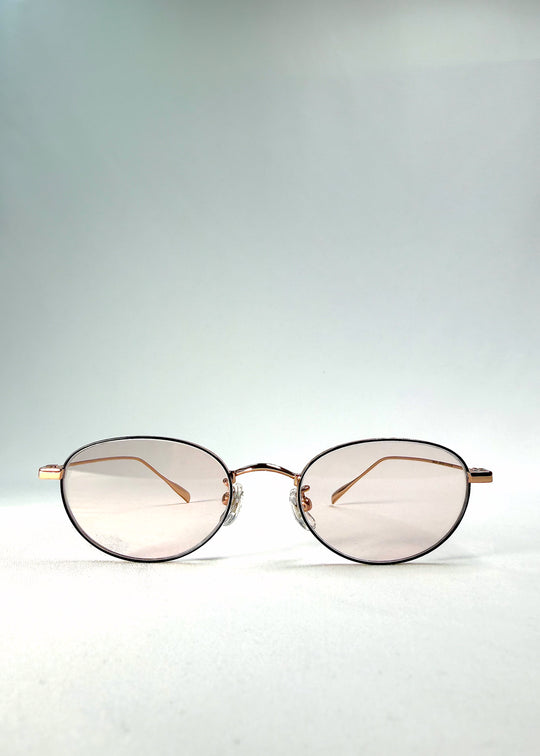 Front view of Vanta Arc Softint sunglasses in Duskgold showing gold frame and rose-beige lenses with UV400 protection.