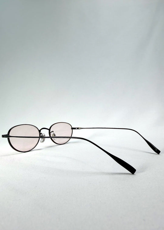 Right side-temple view of Vanta Arc Softint sunglasses in Blush Noir highlighting the slim black titanium temples. 