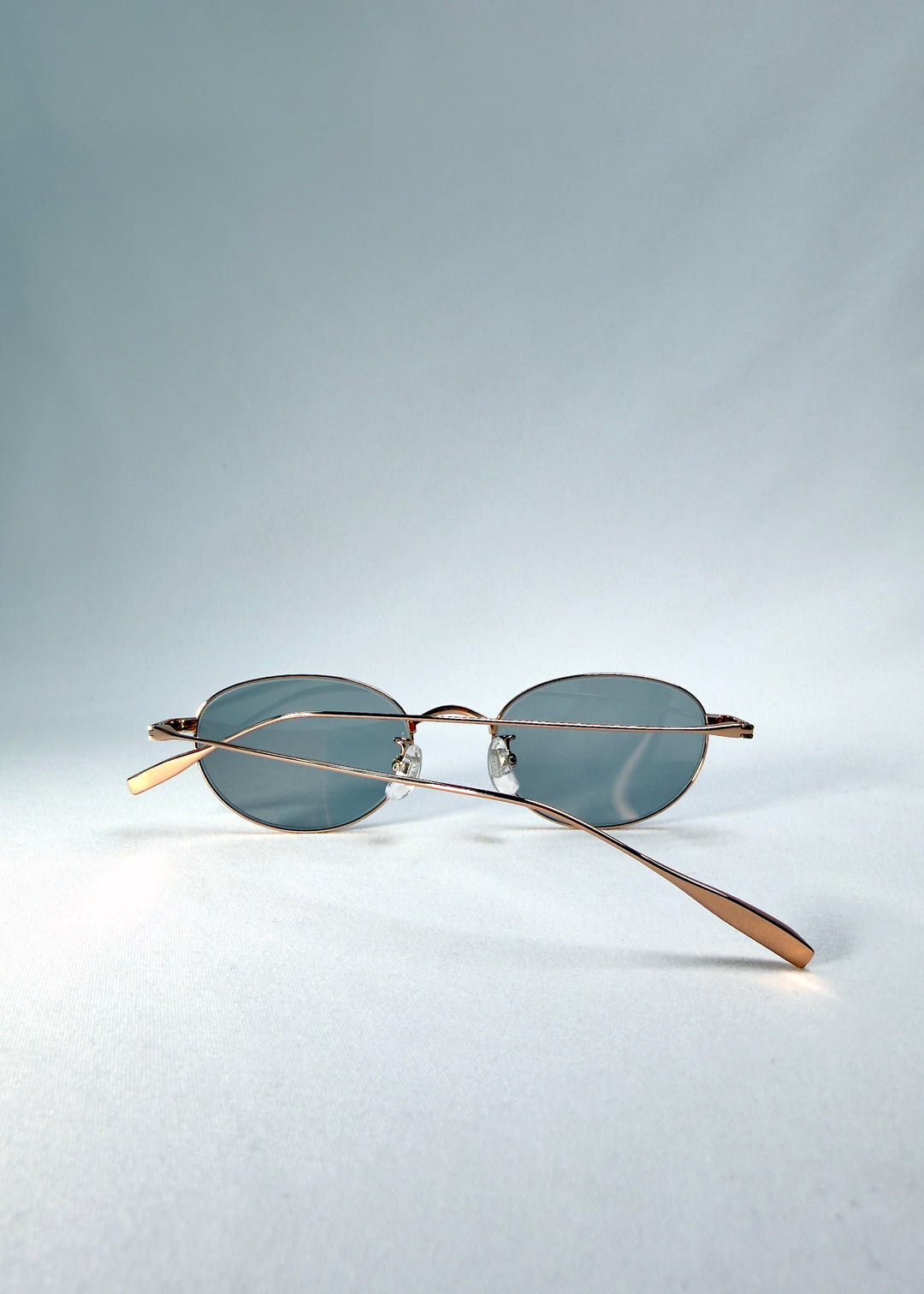 Folded front view of Vanta Arc Softint sunglasses in Roselight with smoke-green Softint lenses featuring Blue Light and UV400 protection.