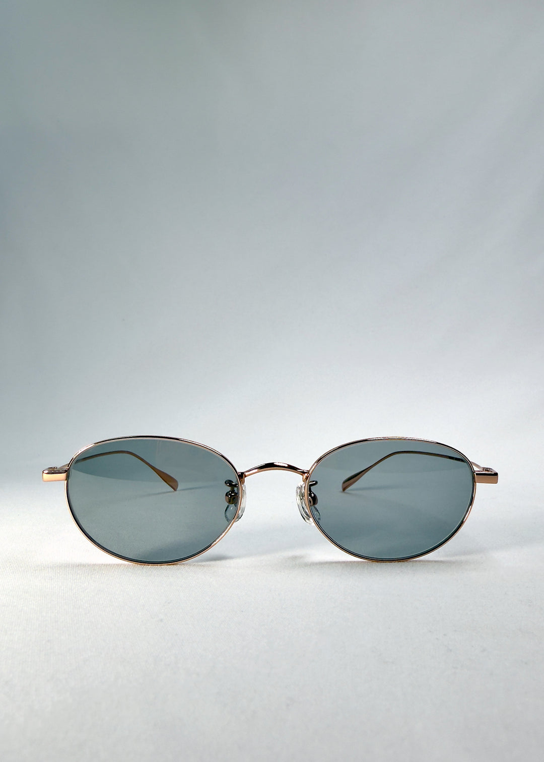 view of Vanta Arc Softint sunglasses in Roselight showing oval frame and smoke-green Softint lenses.
