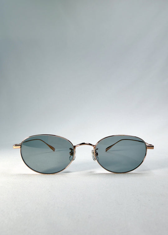 view of Vanta Arc Softint sunglasses in Roselight showing oval frame and smoke-green Softint lenses.