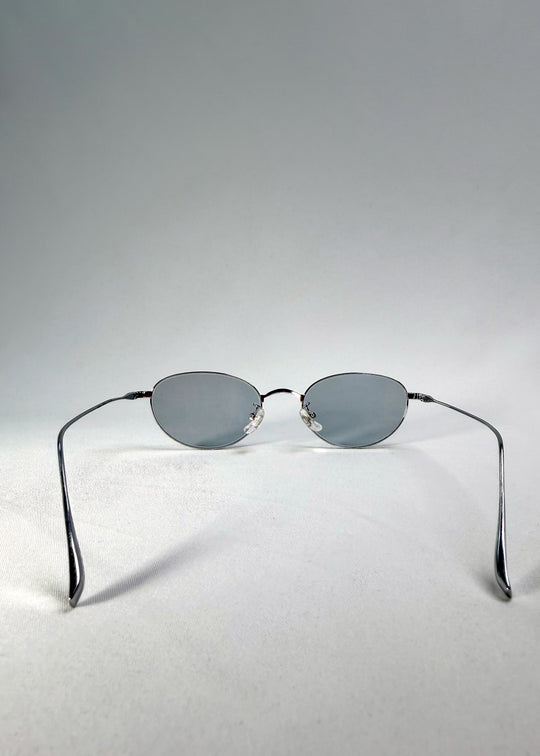 Back view of Vanta Arc Softint sunglasses in Silver Vein showing titanium temples and clean oval lines.
