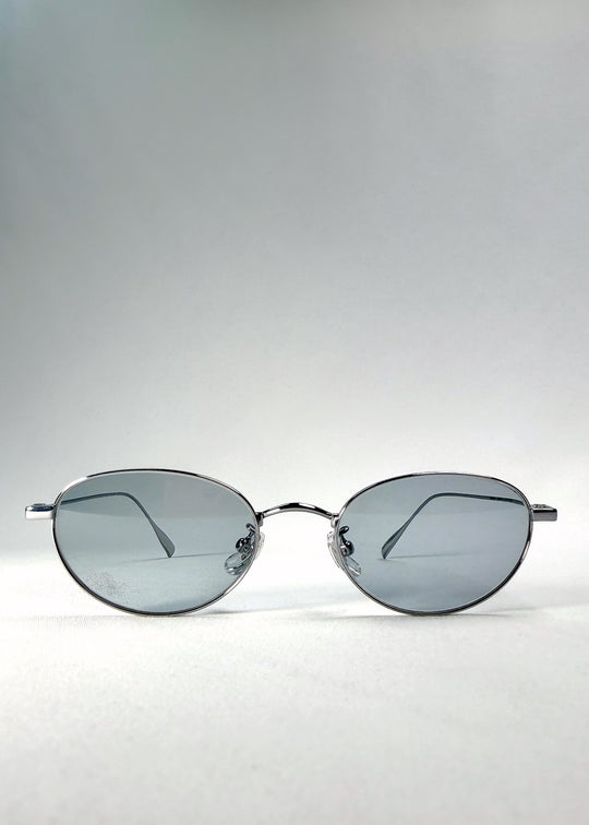 Front view of Vanta Arc Softint sunglasses in Silver Vein showing oval shape and grey-blue Softint lenses with UV400 protection.