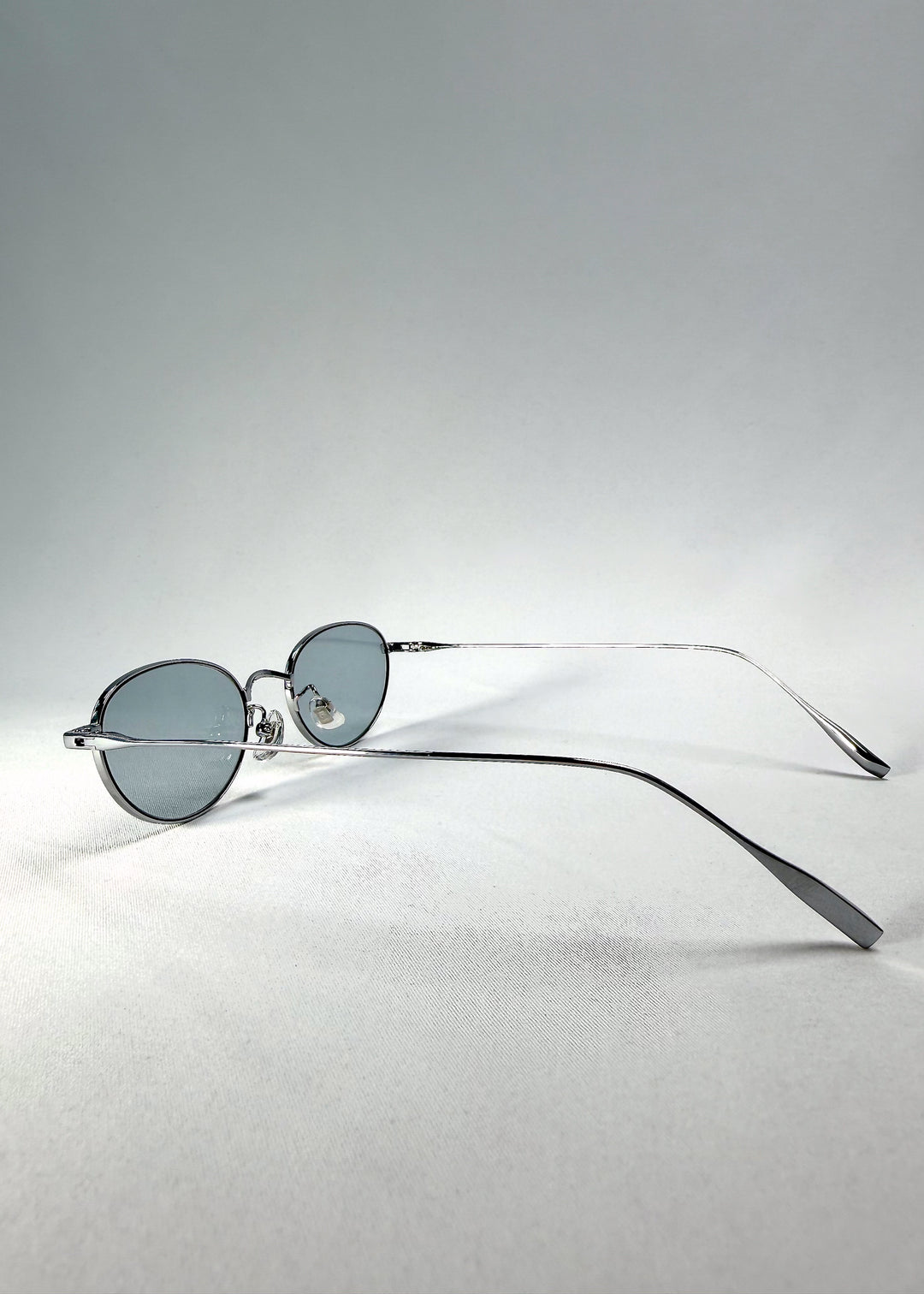 Side-temple view of Vanta Arc Softint sunglasses in Silver Vein showing sleek titanium arms.
