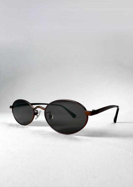 Front angle view of Solstice – Espresso Bronze sunglasses showcasing the rich bronze tone and lightweight silhouette. 