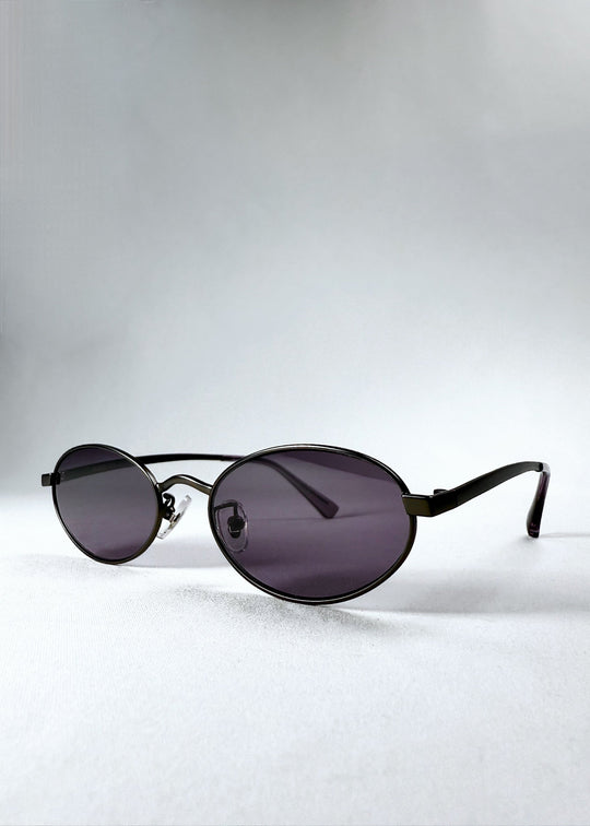 Angled front view of Solstice – Gunmetal Frost showing lens curvature and frame contour. 