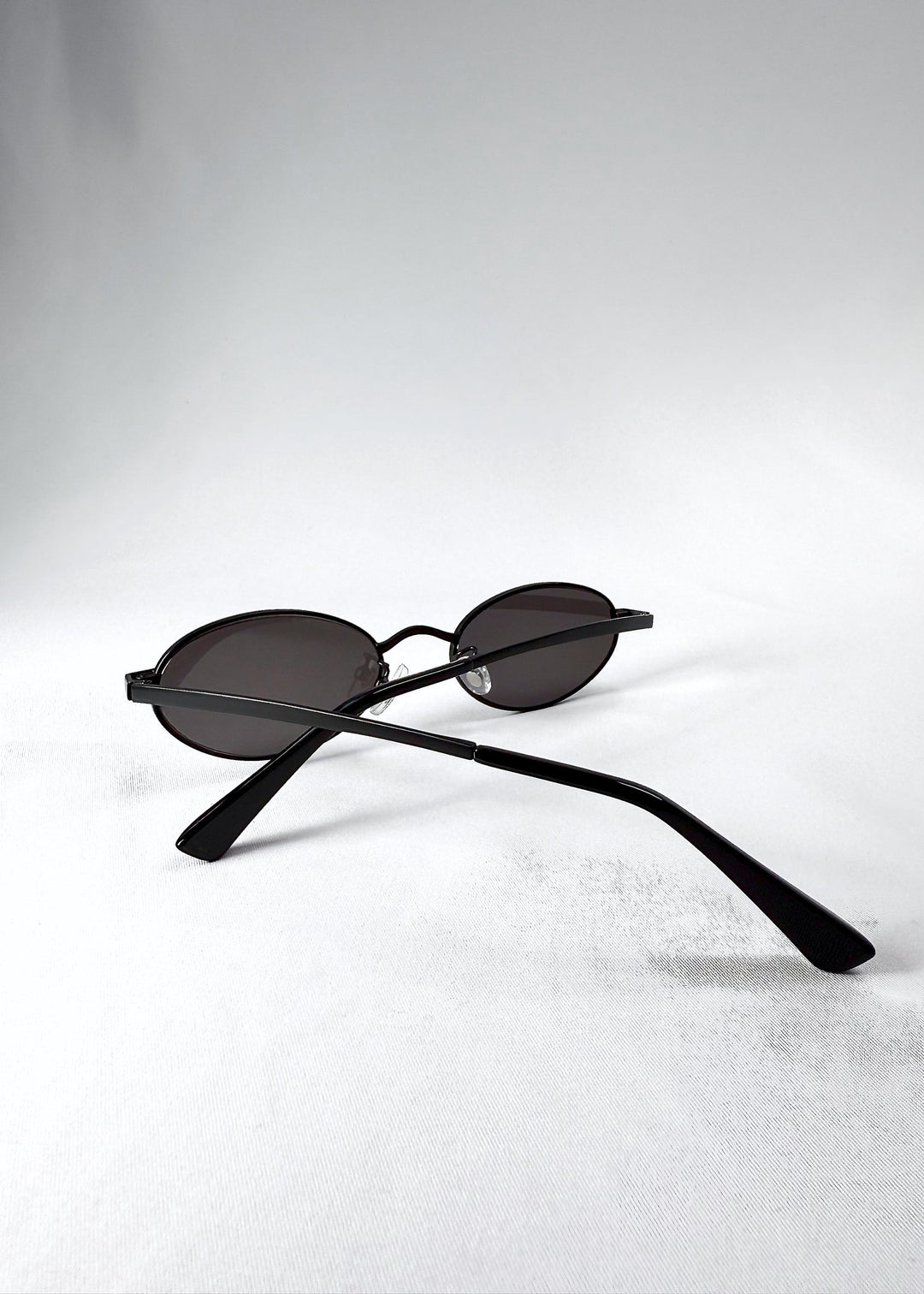 Back view of Solstice – Shadow Black, showing the curvature of the arms and adjustable nose pads. 