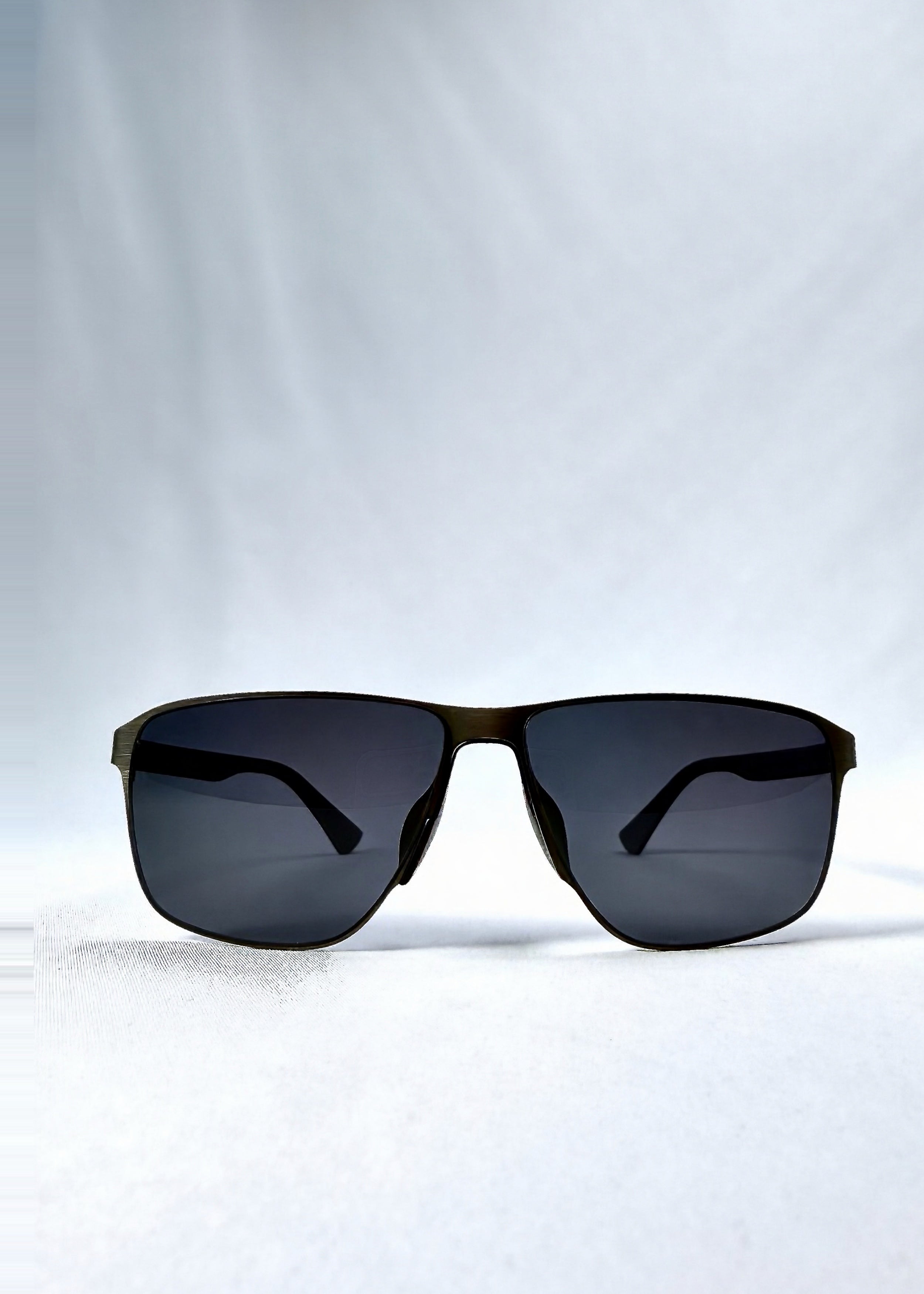 Front view of Vector Line sunglasses in Matte Black, featuring wide matte black rectangular metal frame and full grey polarized lenses, showing the full front silhouette.