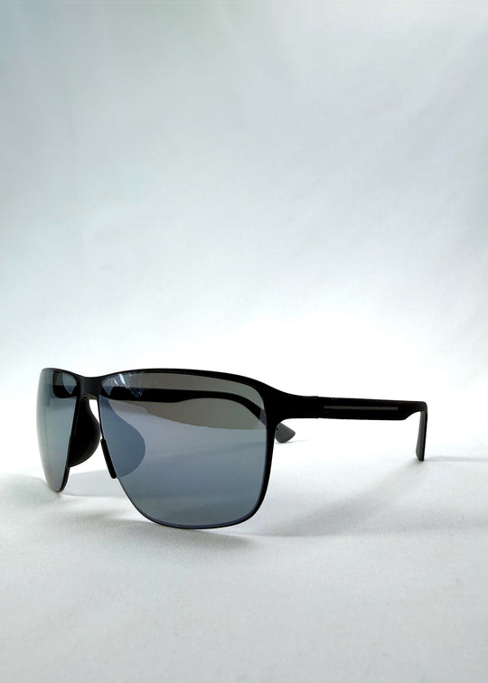 Three-quarter front view of Vector Line sunglasses in Mercury Shadow, featuring wide black metal frame and silver mirrored polarized lenses, showing the front shape and temple profile.