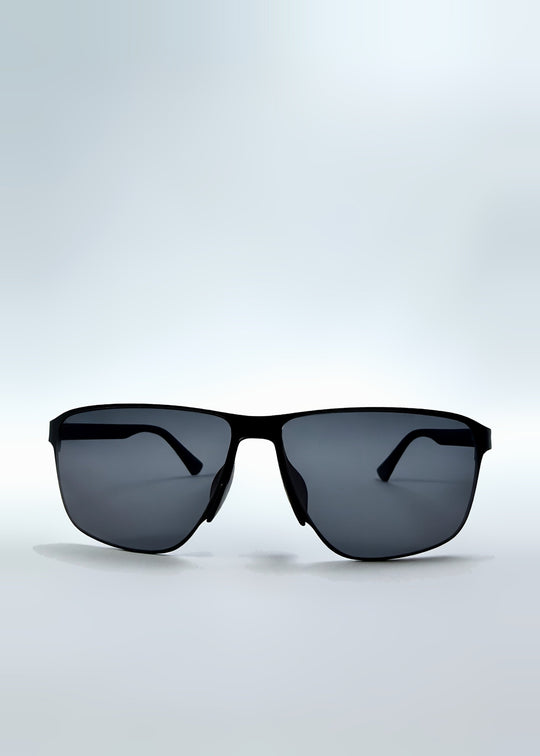 Front view of Vector Line sunglasses in Violet Graphite, featuring wide gunmetal frame and violet-grey polarized lenses, showing the full front silhouette. 