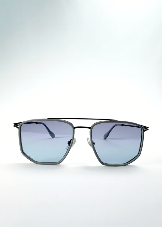Front view of AZE Vela Trace sunglasses in Midnight Blue, featuring a gray-blue rectangular frame and blue-gray gradient lenses, showing the full front silhouette.