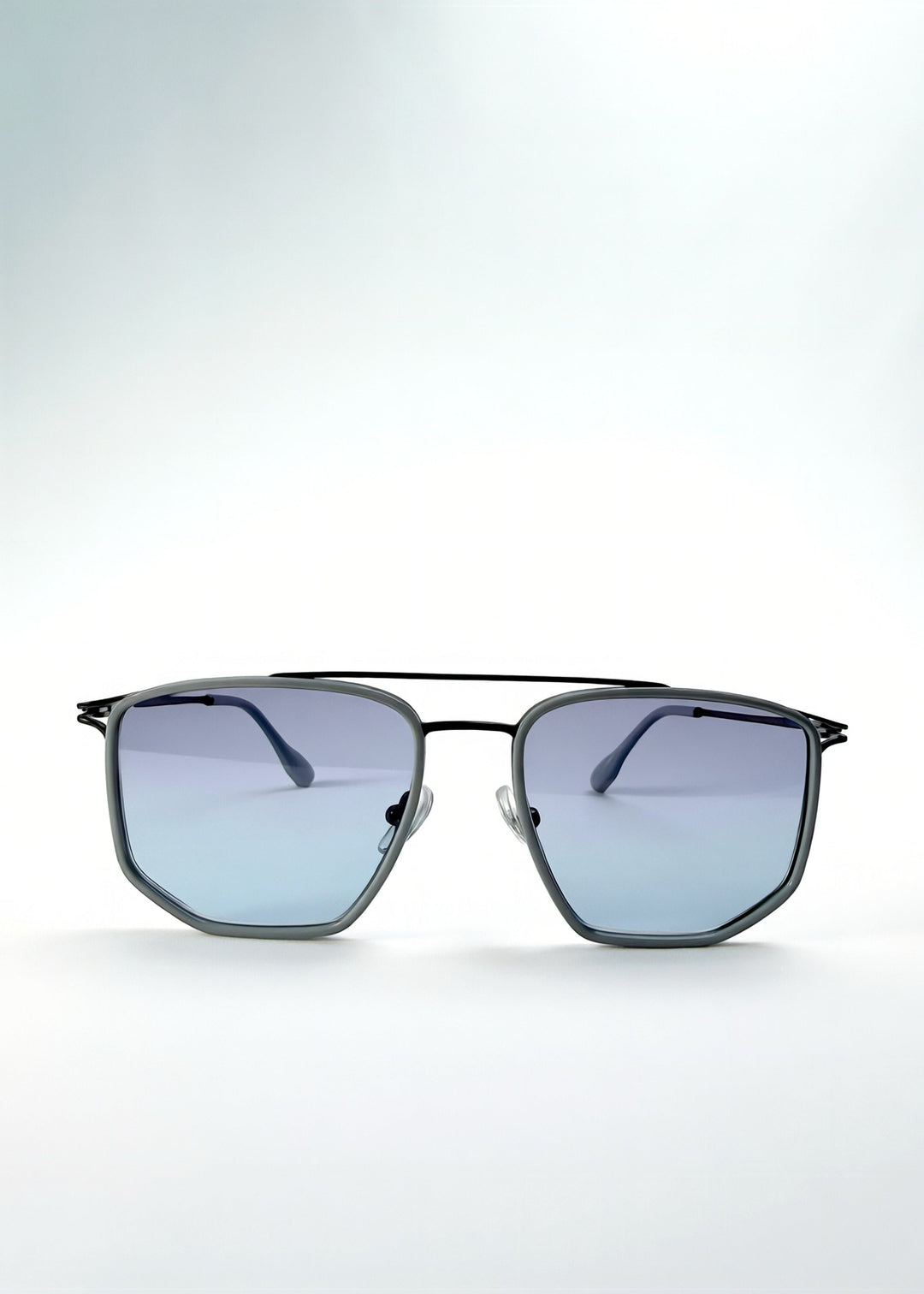 Front view of AZE Vela Trace sunglasses in Midnight Blue, featuring a gray-blue rectangular frame and blue-gray gradient lenses, showing the full front silhouette. 