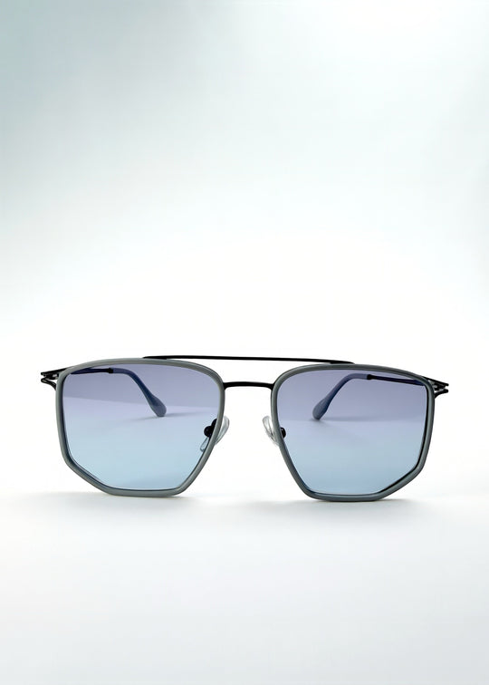 Front view of AZE Vela Trace sunglasses in Midnight Blue, featuring a gray-blue rectangular frame and blue-gray gradient lenses, showing the full front silhouette. 