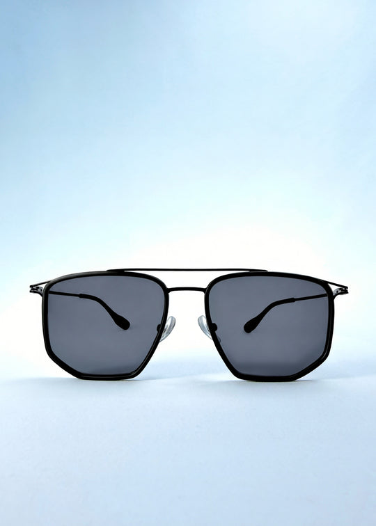 Front view of AZE Vela Trace sunglasses in Obsidian Black, featuring a structured black rectangular frame and smoky gray lenses, showing the full front silhouette.