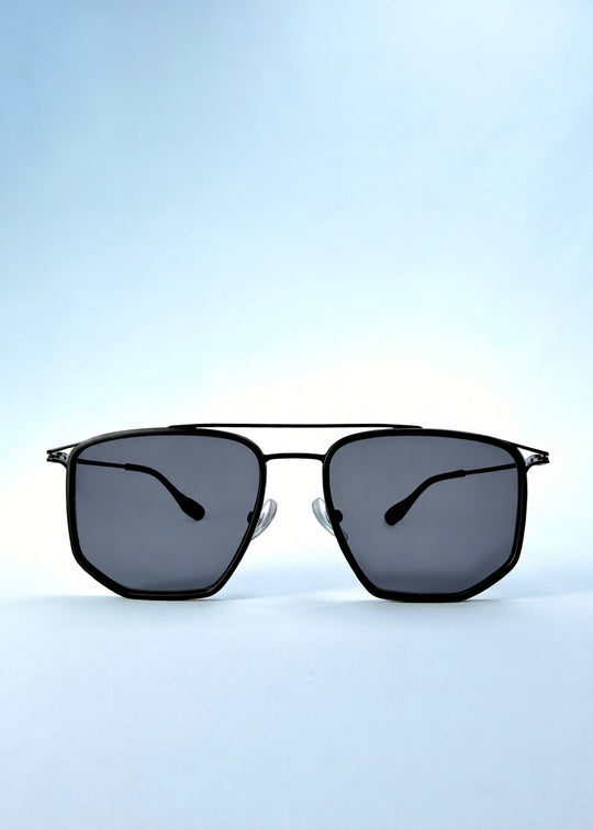 Front view of AZE Vela Trace sunglasses in Obsidian Black, featuring a structured black rectangular frame and smoky gray lenses, showing the full front silhouette. 