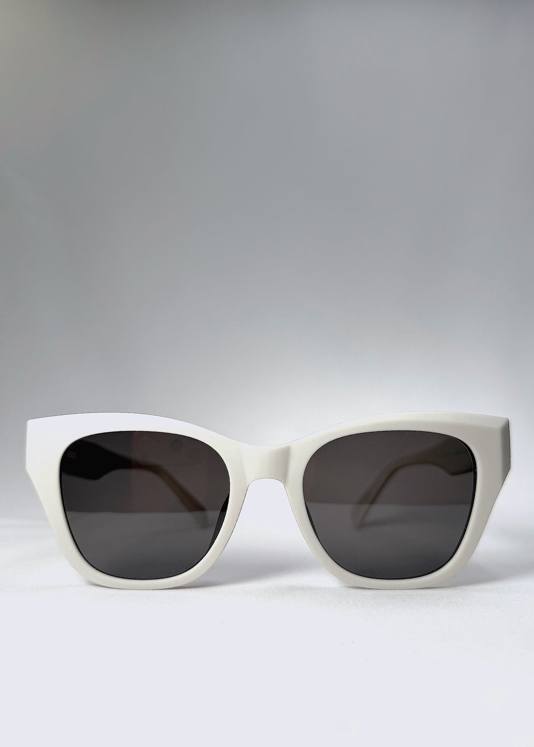 Front view of Veyron in Pale Mirage with soft matte grey acetate frame and tea-grey polarized lenses, showcasing its minimalist elegance.
