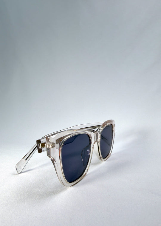 Right front-angle view of Veyron in Crystal Static, showing the clear frame edges and slate blue lenses. 