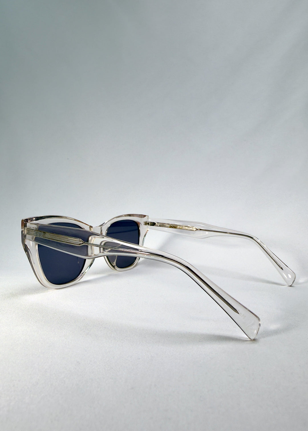 Side-temple view of Veyron in Crystal Static, showing the tapered acetate temples and solid hinge design. 