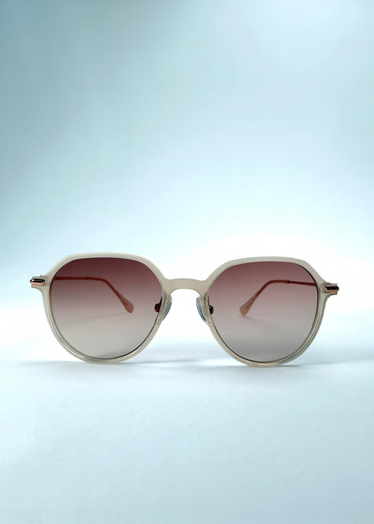 Front view of AZE Vireo Arc sunglasses in Roselight, featuring a translucent ivory frame and soft rose gradient lenses, showing the full front silhouette.