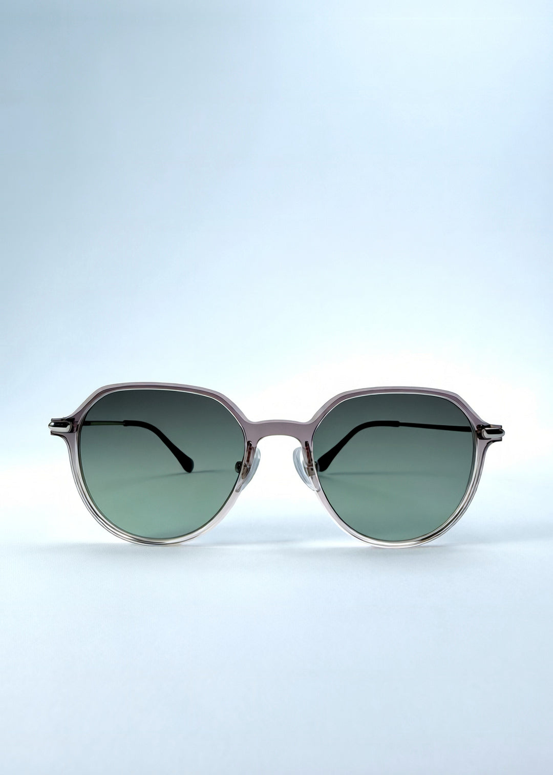 Front view of AZE Vireo Arc sunglasses in Verdant Halo, featuring a translucent smoky mauve frame and green gradient lenses, showing the full front silhouette.