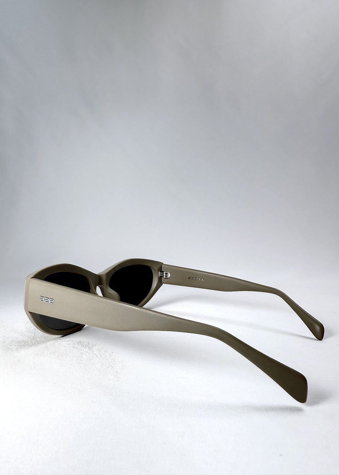 Side view highlighting the wide temple arms and clean bronze acetate finish of the Void Striker sunglasses. 