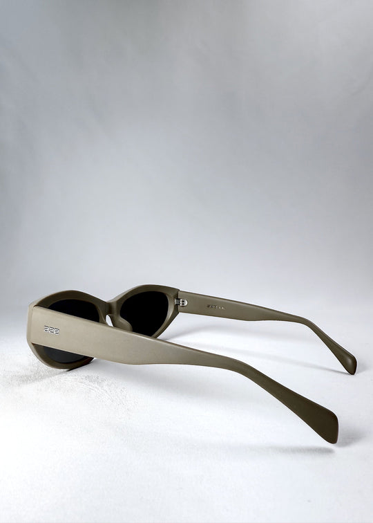 Side view highlighting the wide temple arms and clean bronze acetate finish of the Void Striker sunglasses. 